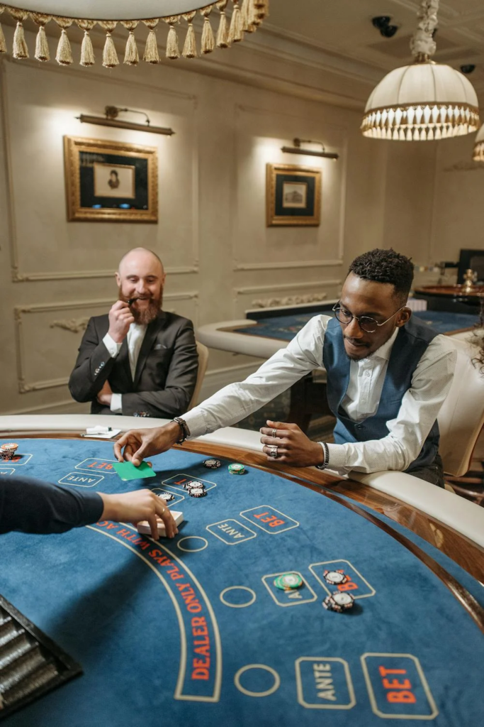 A group of people enjoys a casino game.