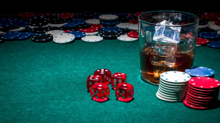 a glass of whiskey on a casino table