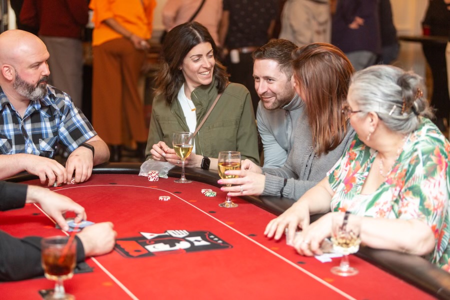 A group enjoys a casino event.
